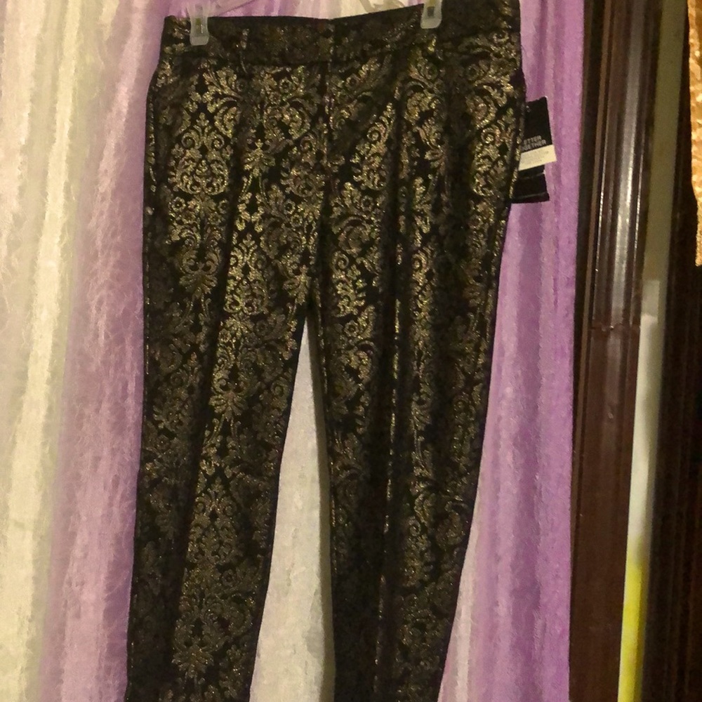 Dress pant. Beautiful design glimering gold on top of black material.